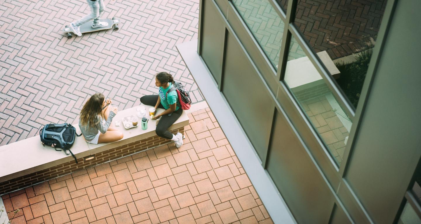 students hanging out on campus