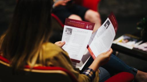 students looking at handout